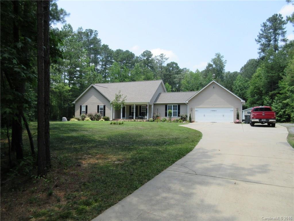 632 Hall Spencer Road Catawba, SC 29704 - Photo 1 of 17 a front view of a house with garden