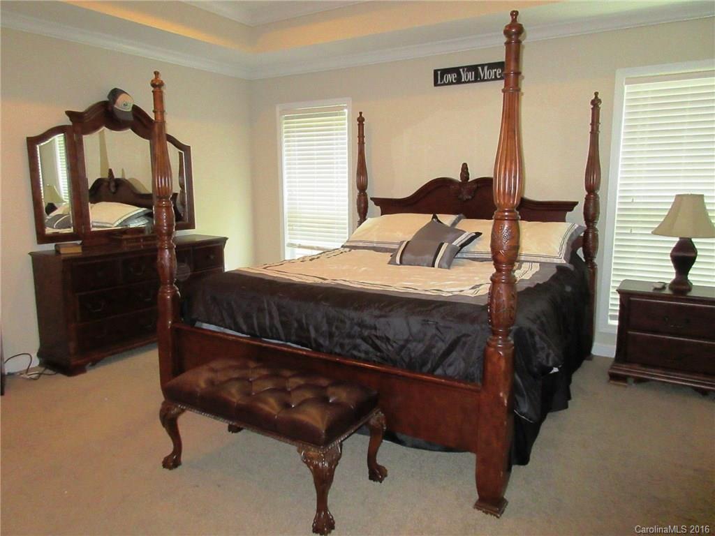 632 Hall Spencer Road Catawba, SC 29704 - Photo 6 of 17 a bedroom with a bed a mirror and dresser