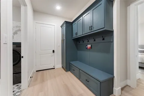 a bathroom with a sink a washer and dryer