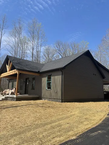 a house with trees in the background