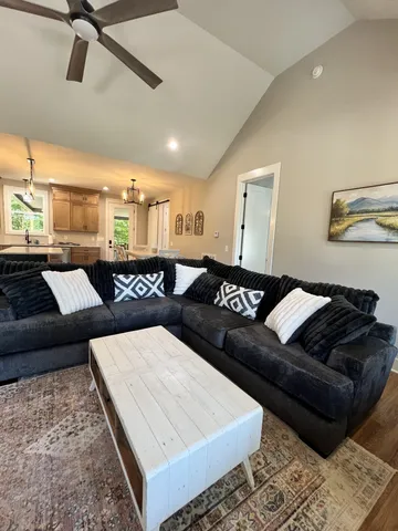 a living room with furniture and a rug