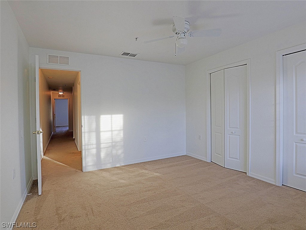 9419 Ivy Brook Run, Unit 1204 Fort Myers, FL 33913 - Photo 12 of 22 a view of a room with a hallway and closet