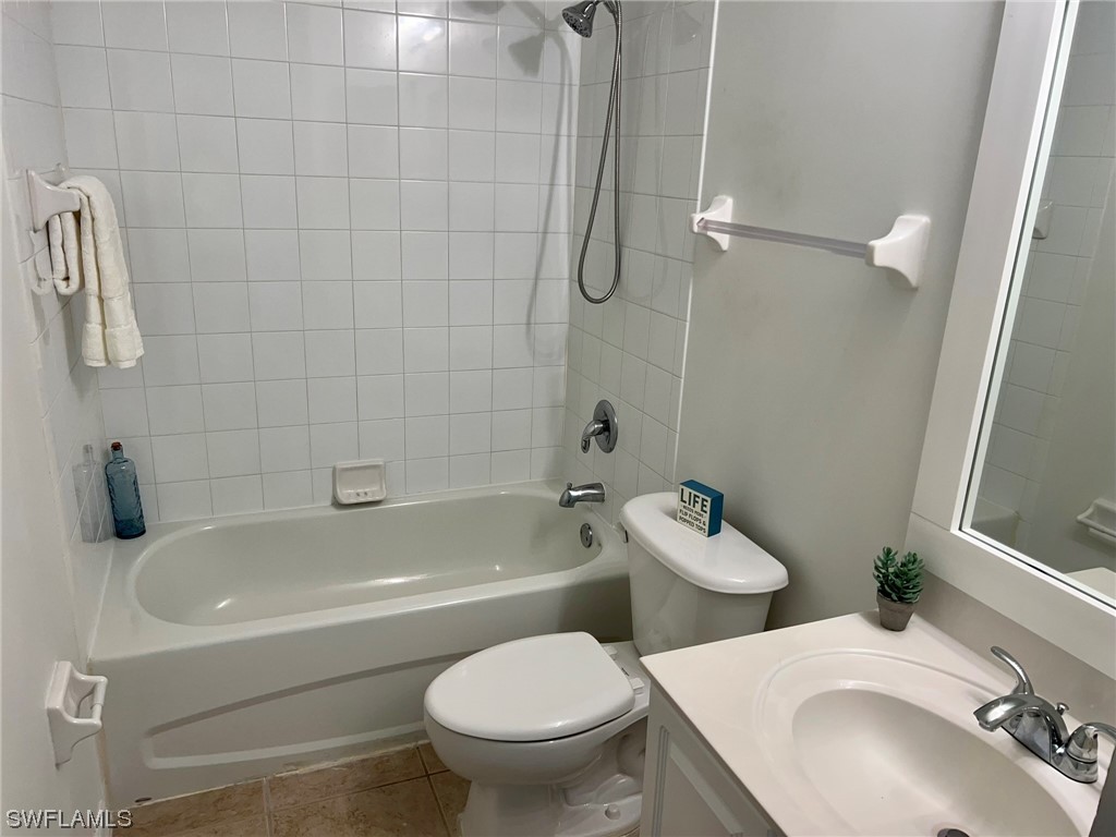 9419 Ivy Brook Run, Unit 1204 Fort Myers, FL 33913 - Photo 13 of 22 a bathroom with a sink toilet and shower