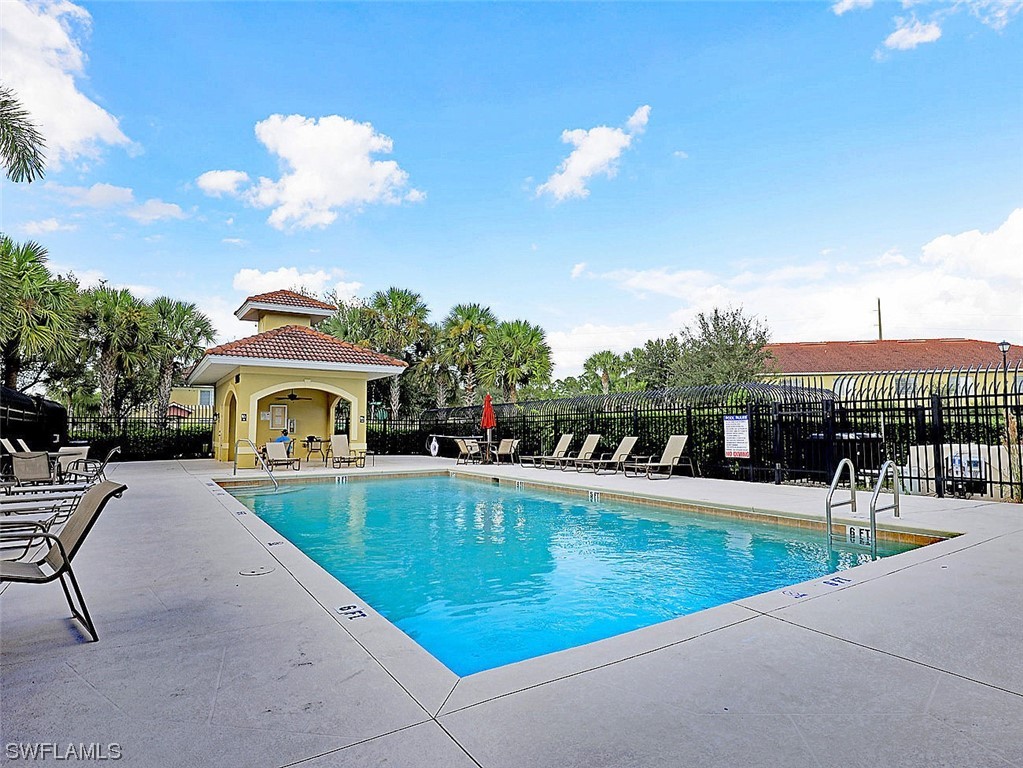 9419 Ivy Brook Run, Unit 1204 Fort Myers, FL 33913 - Photo 20 of 22 a view of a swimming pool with a patio