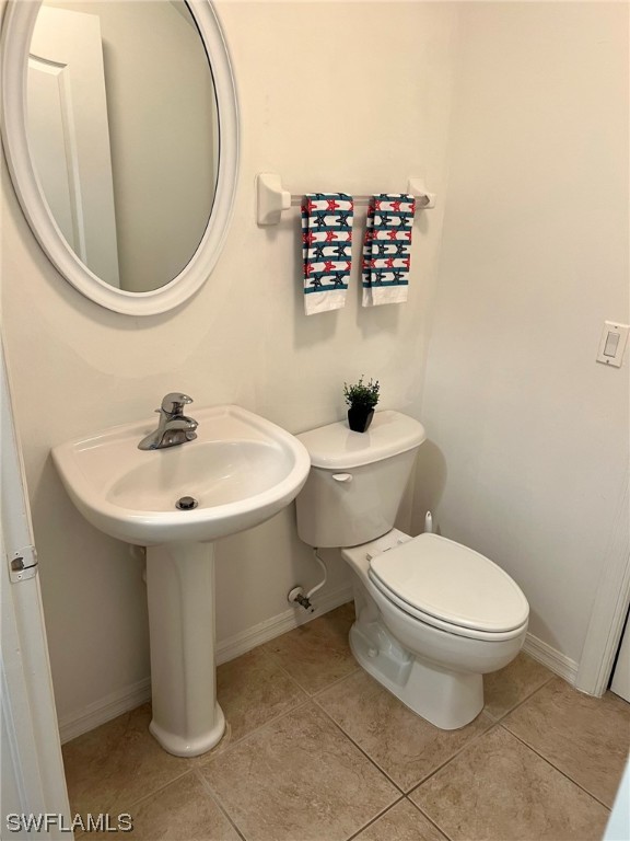 9419 Ivy Brook Run, Unit 1204 Fort Myers, FL 33913 - Photo 7 of 22 a white toilet sitting next to a bathroom sink