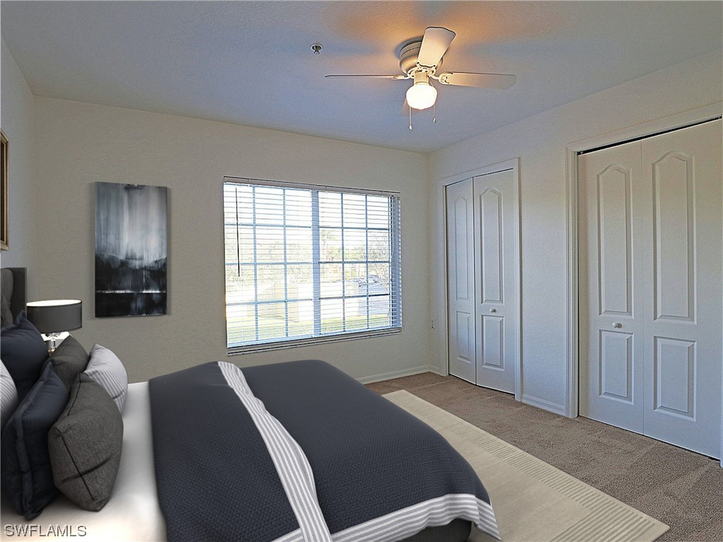 9419 Ivy Brook Run, Unit 1204 Fort Myers, FL 33913 - Photo 9 of 22 a bedroom with a bed ceiling fan and a window