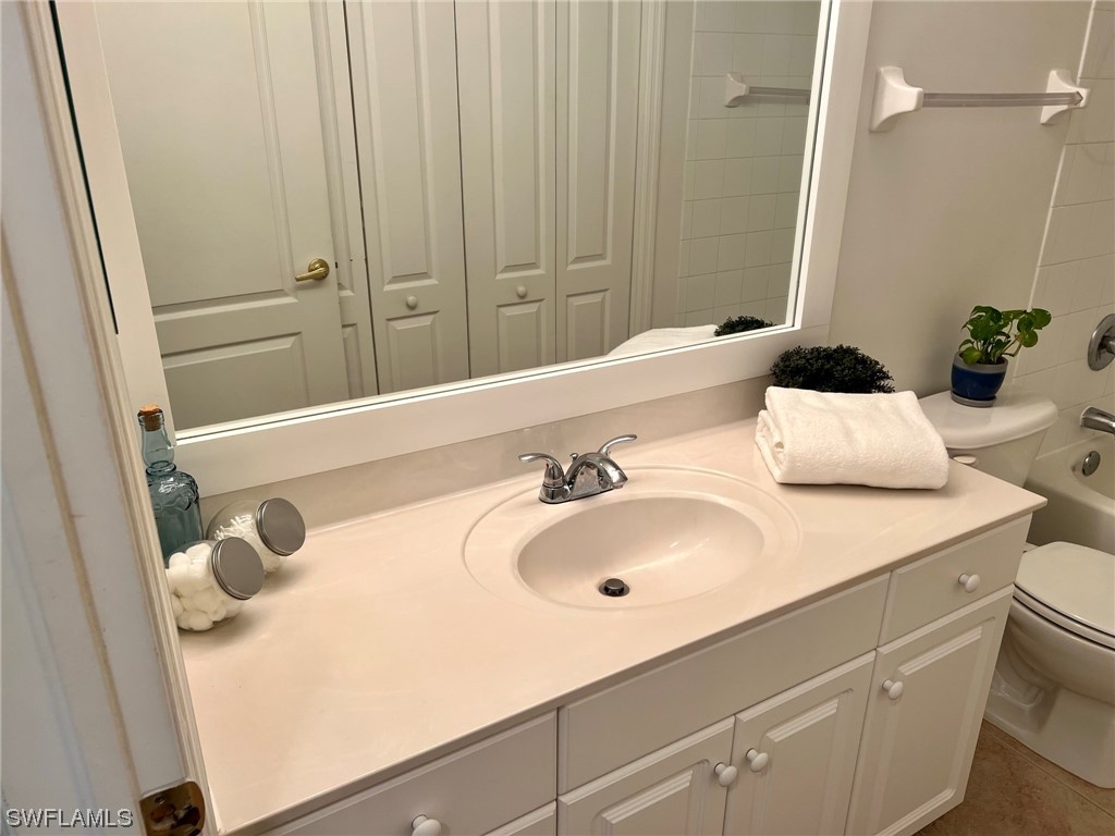 9419 Ivy Brook Run, Unit 1204 Fort Myers, FL 33913 - Photo 10 of 22 a bathroom with a sink and a mirror