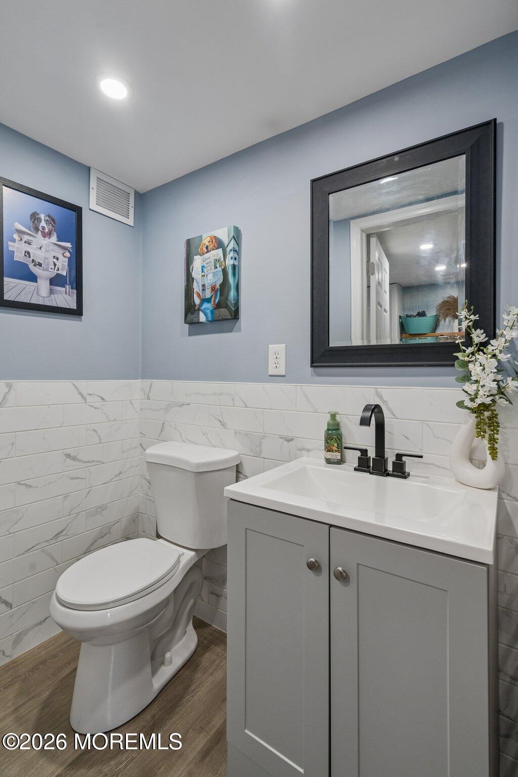 121 Corson Avenue Hamilton, NJ 08619 - Photo 14 of 32 a bathroom with a toilet a sink and mirror