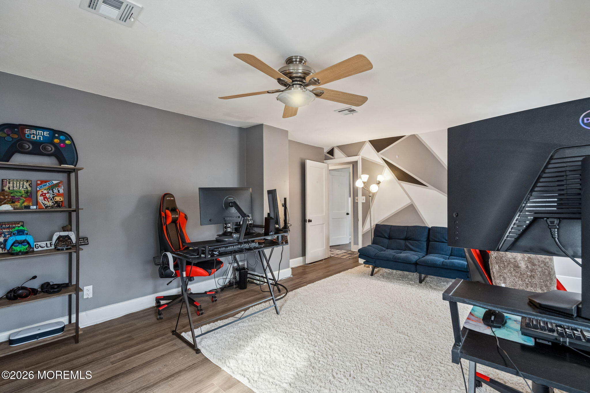 121 Corson Avenue Hamilton, NJ 08619 - Photo 18 of 32 a view of a livingroom with workspace and a ceiling fan