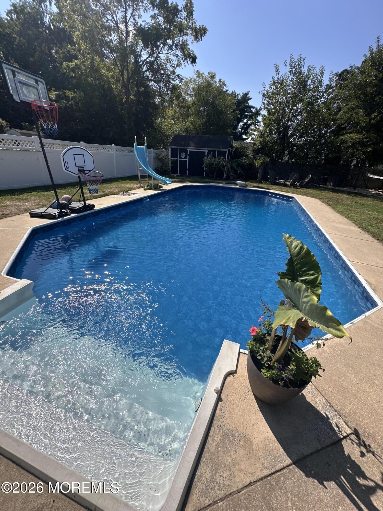 121 Corson Avenue Hamilton, NJ 08619 - Photo 31 of 32 a view of swimming pool with lounge chair