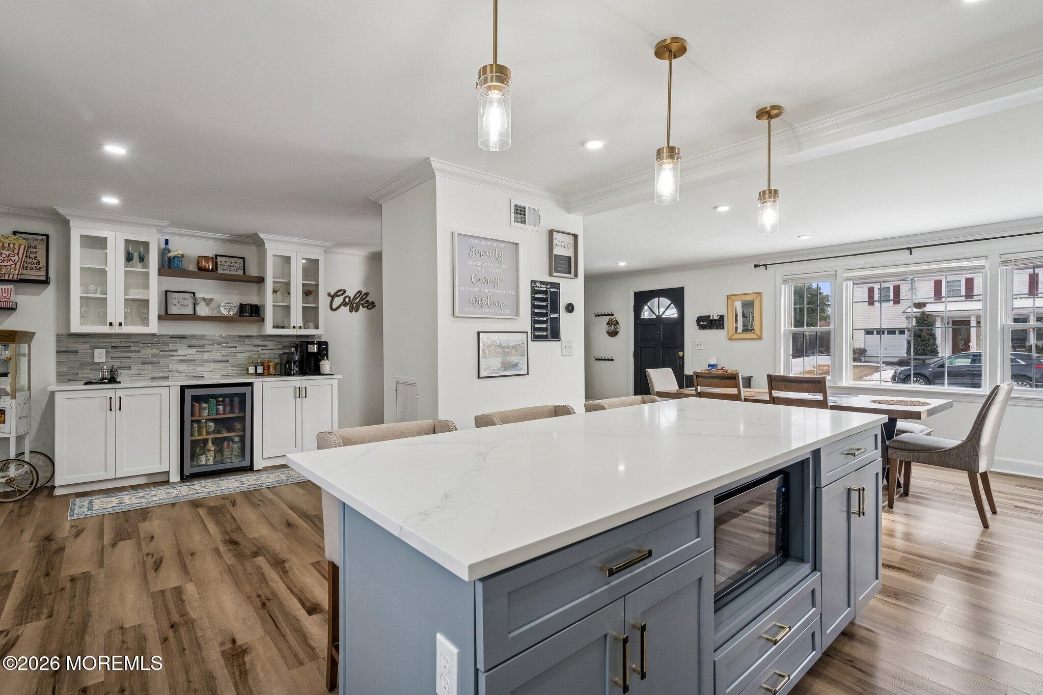 121 Corson Avenue Hamilton, NJ 08619 - Photo 8 of 32 a kitchen with a stove a refrigerator and a sink