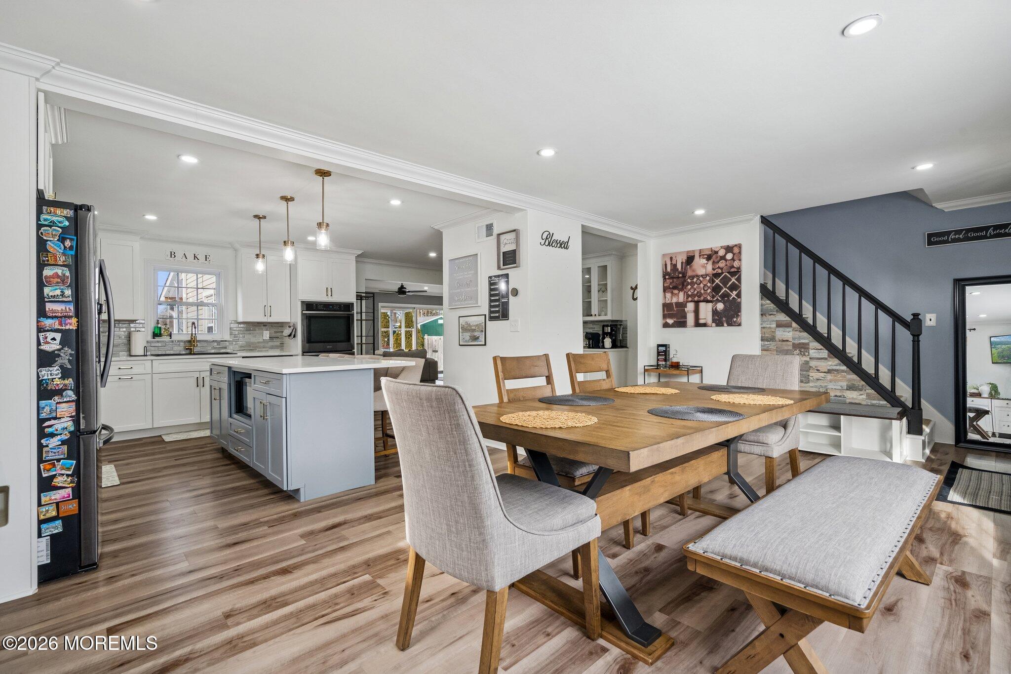 121 Corson Avenue Hamilton, NJ 08619 - Photo 9 of 32 a view of a dining room with furniture and wooden floor