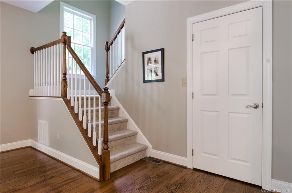 1600 Stevens Ridge Road Matthews, NC 28105 - Photo 22 of 35 a view of a hallway with wooden floor and entryway