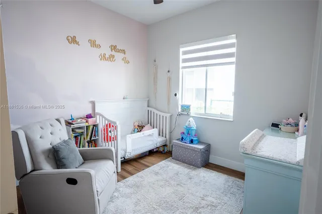 a bedroom with furniture and a window
