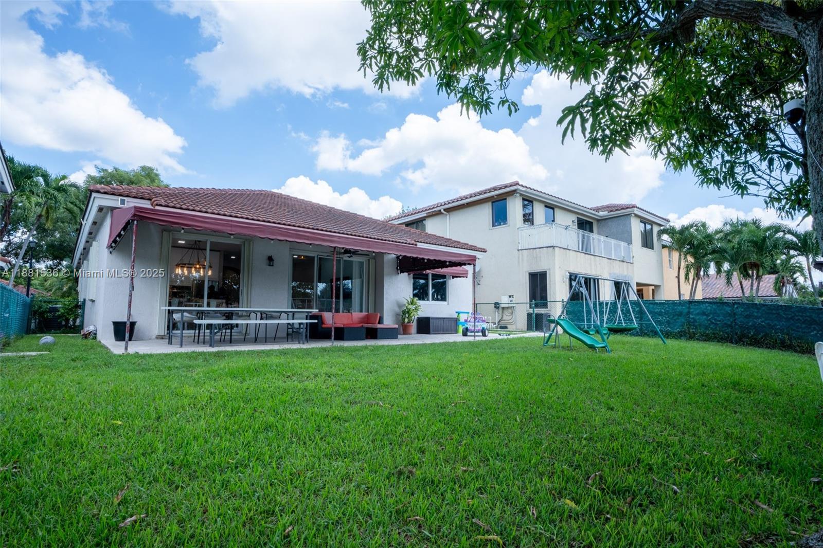 13000 Southwest 52nd Street Miramar, FL 33027 - Photo 14 of 16 a front view of house with yard barbeque and outdoor seating