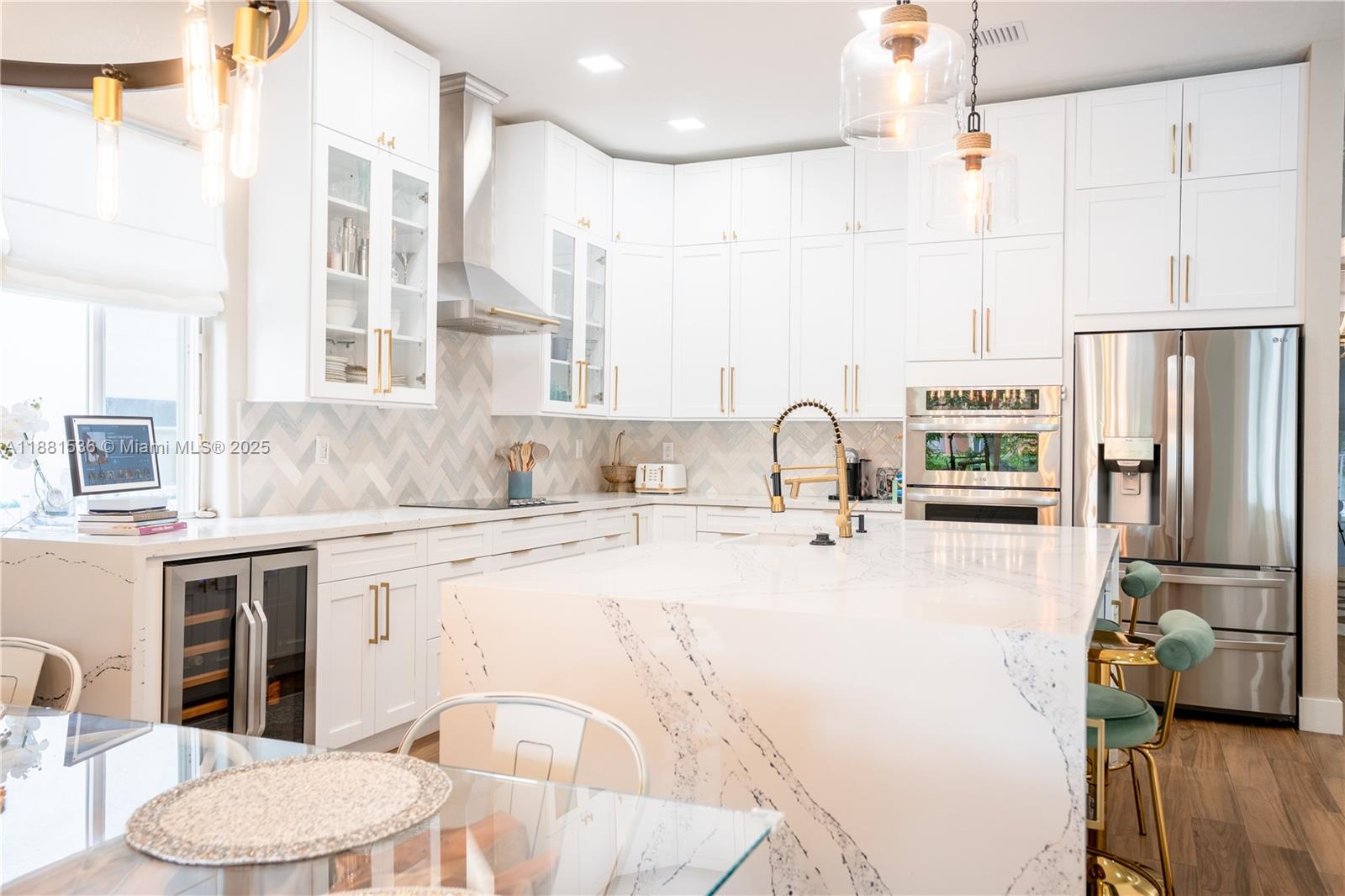 13000 Southwest 52nd Street Miramar, FL 33027 - Photo 6 of 16 a kitchen with stainless steel appliances a sink stove and refrigerator
