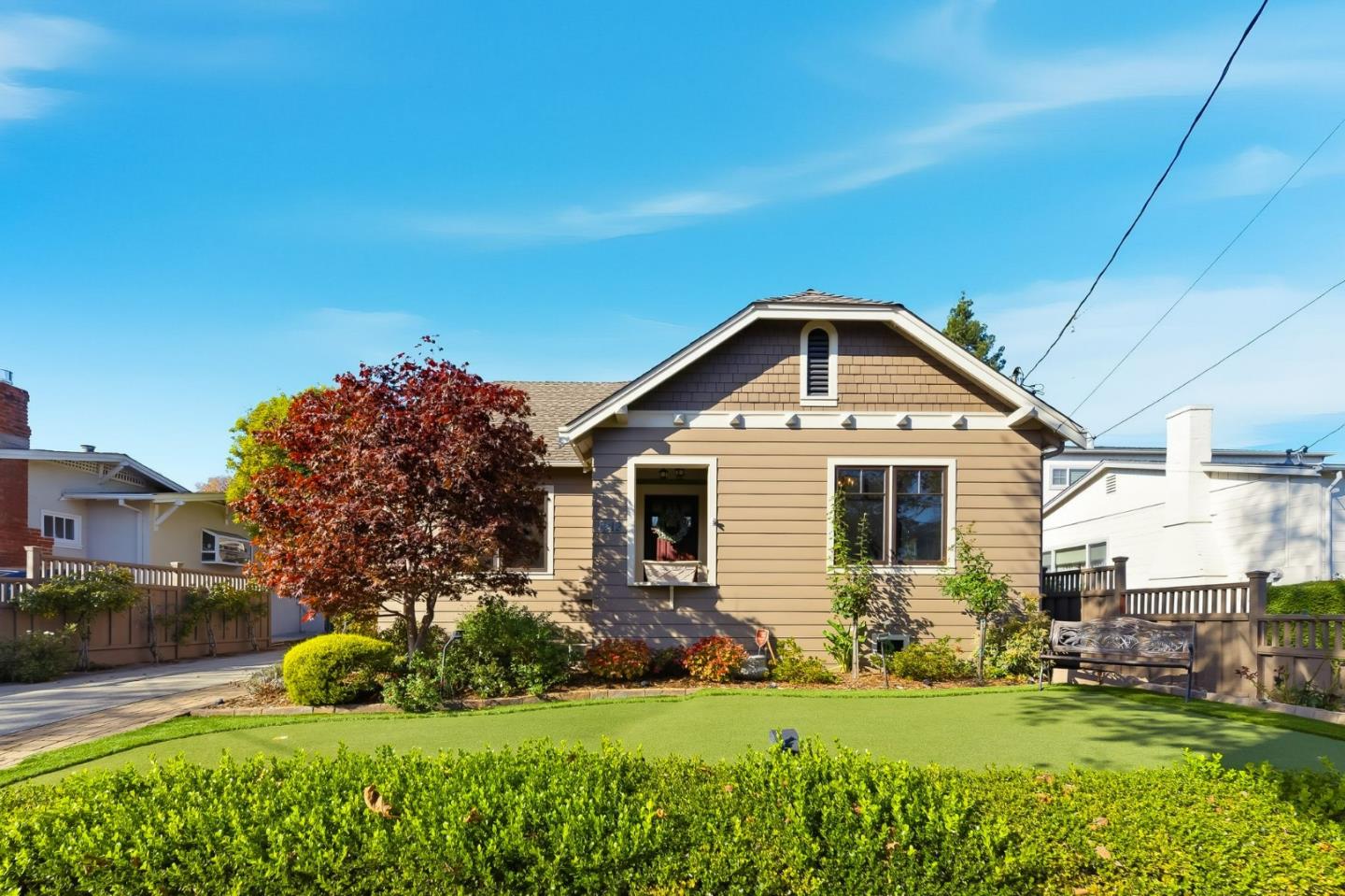 a front view of a house with a yard