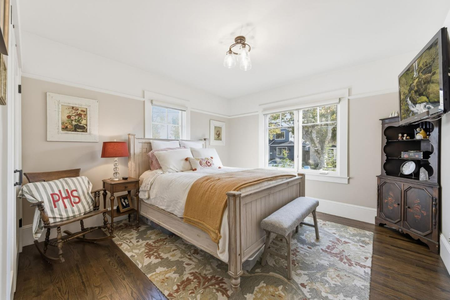 1212 Mills Avenue Burlingame, CA 94010 - Photo 12 of 32 a bedroom with a bed and a flat screen tv