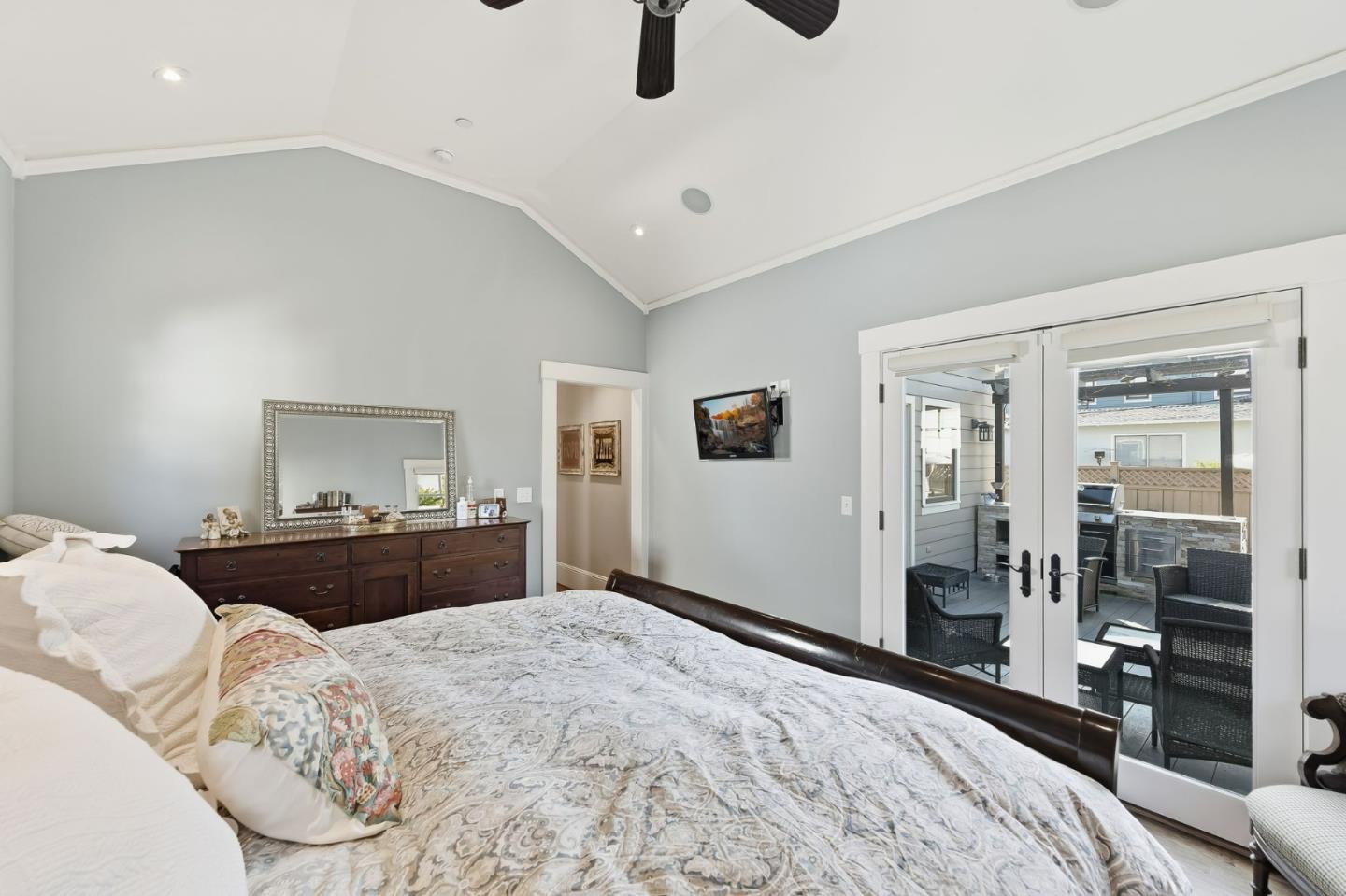 1212 Mills Avenue Burlingame, CA 94010 - Photo 17 of 32 a bedroom with a bed and dresser with mirror