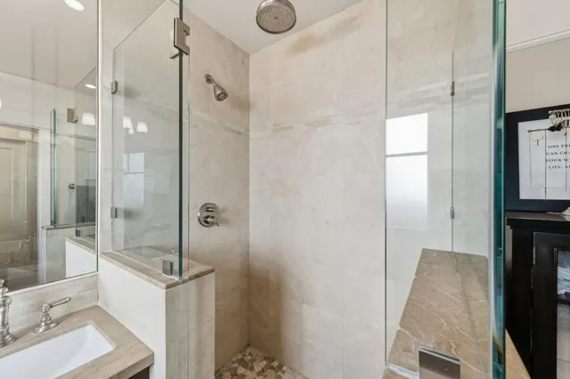 a bathroom with a shower and a sink