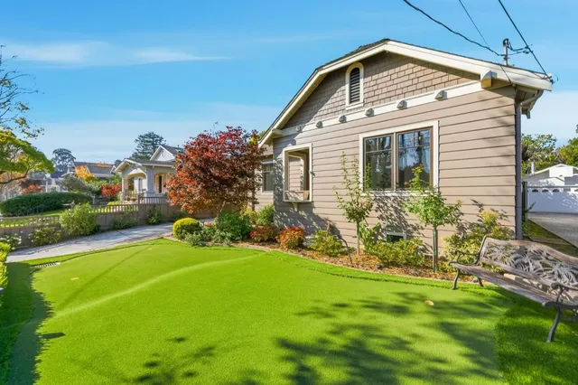 a front view of a house with a yard