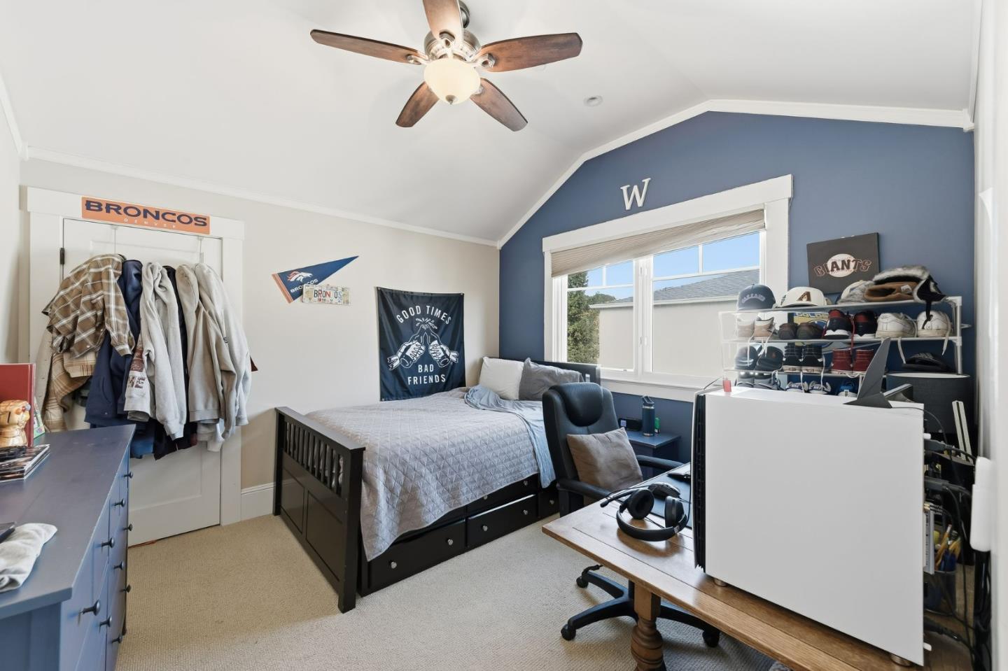 1212 Mills Avenue Burlingame, CA 94010 - Photo 22 of 32 a bedroom with a bed and a chandelier