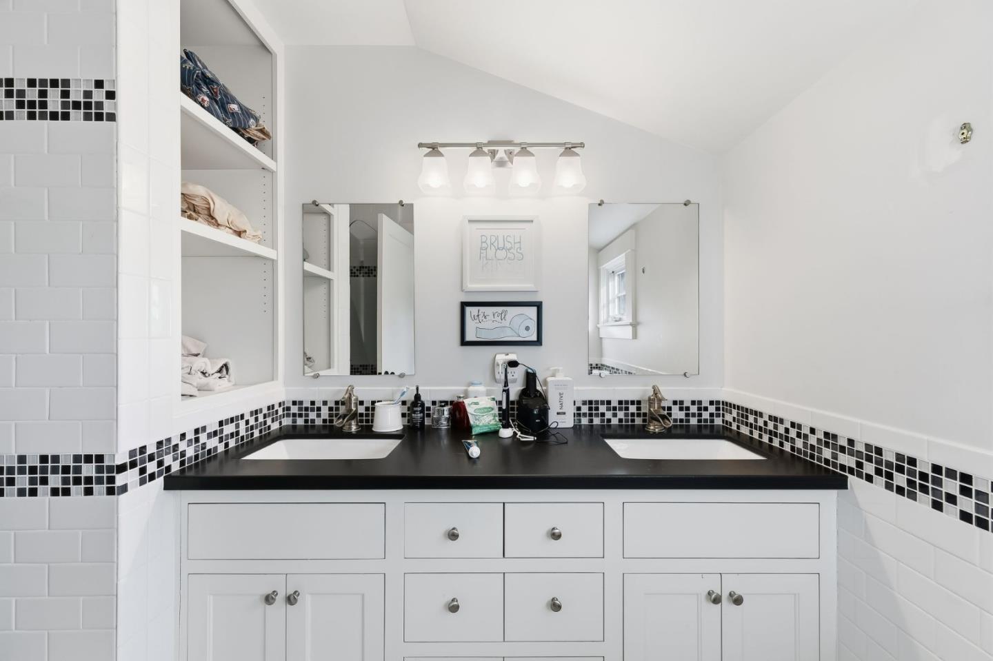 1212 Mills Avenue Burlingame, CA 94010 - Photo 26 of 32 a bathroom with a sink and a mirror