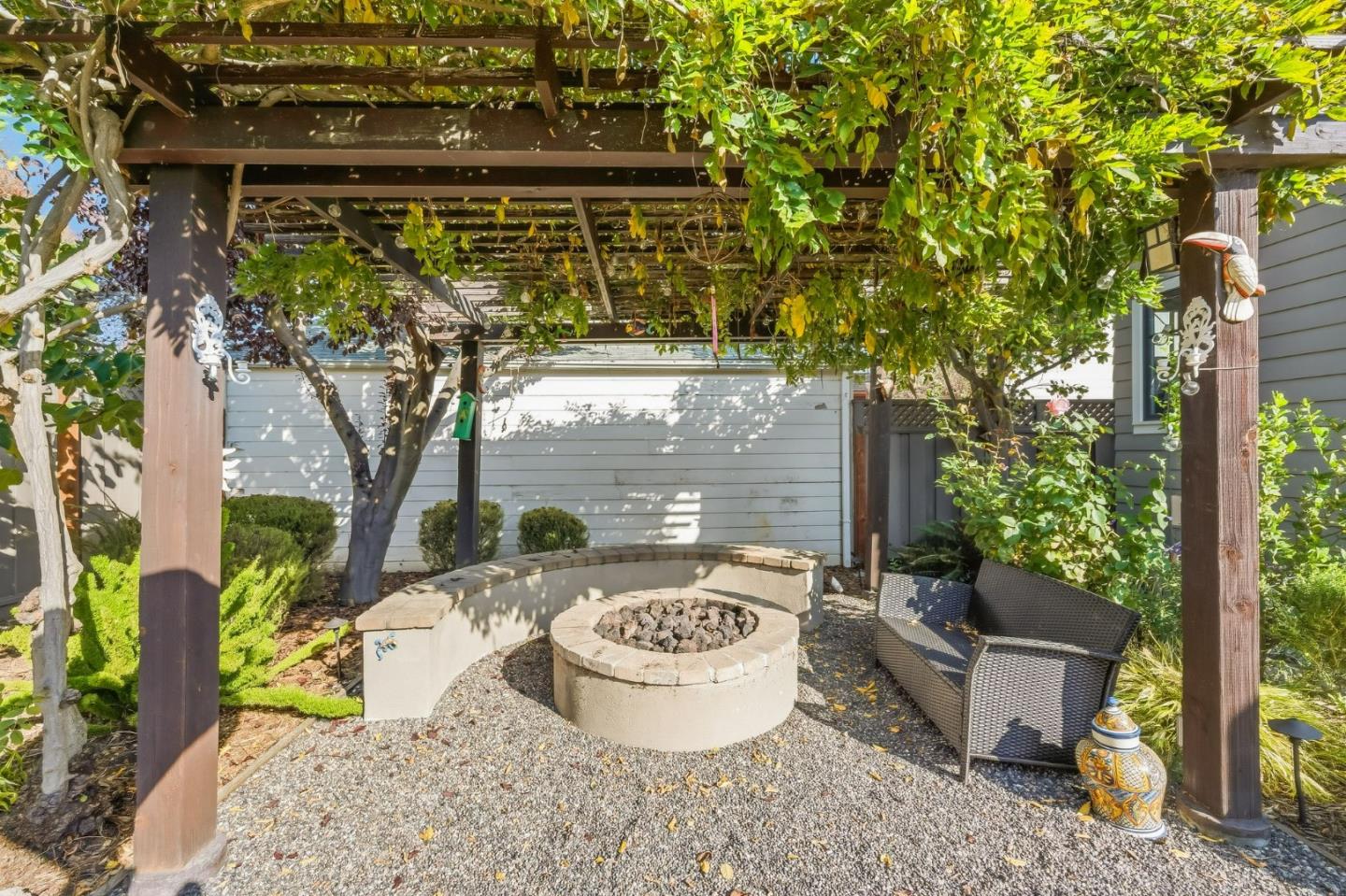 1212 Mills Avenue Burlingame, CA 94010 - Photo 30 of 32 a view of a patio with table and chairs potted plants and large tree