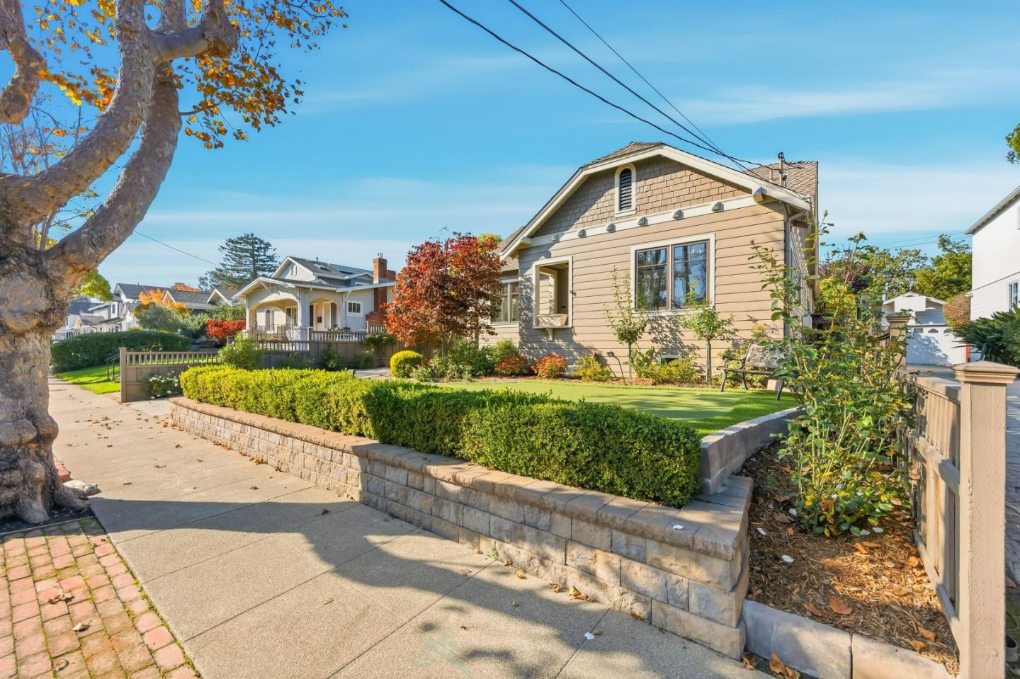 1212 Mills Avenue Burlingame, CA 94010 - Photo 3 of 32 a front view of a house with garden