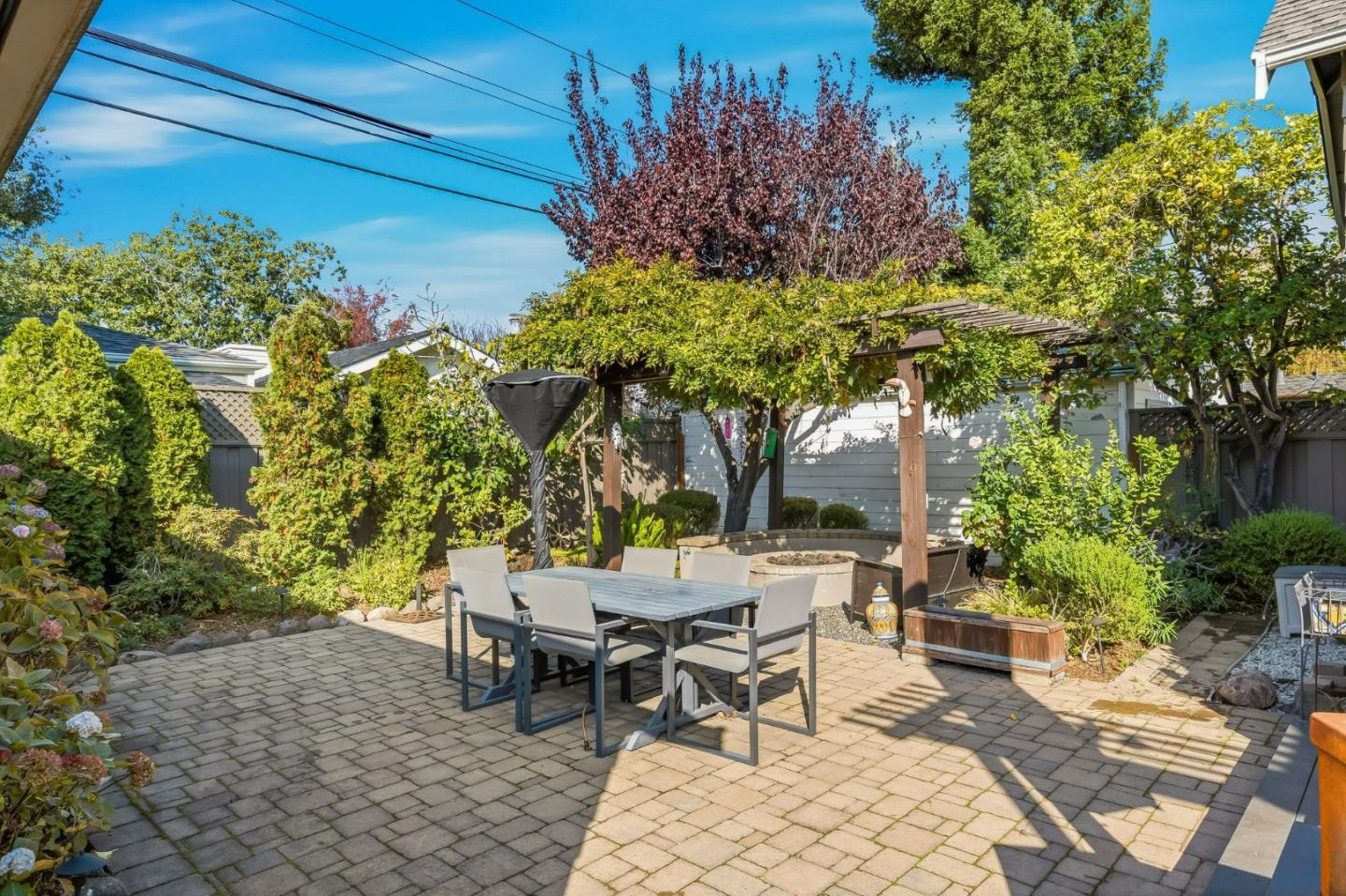 1212 Mills Avenue Burlingame, CA 94010 - Photo 31 of 32 a view of a chairs and table in a backyard