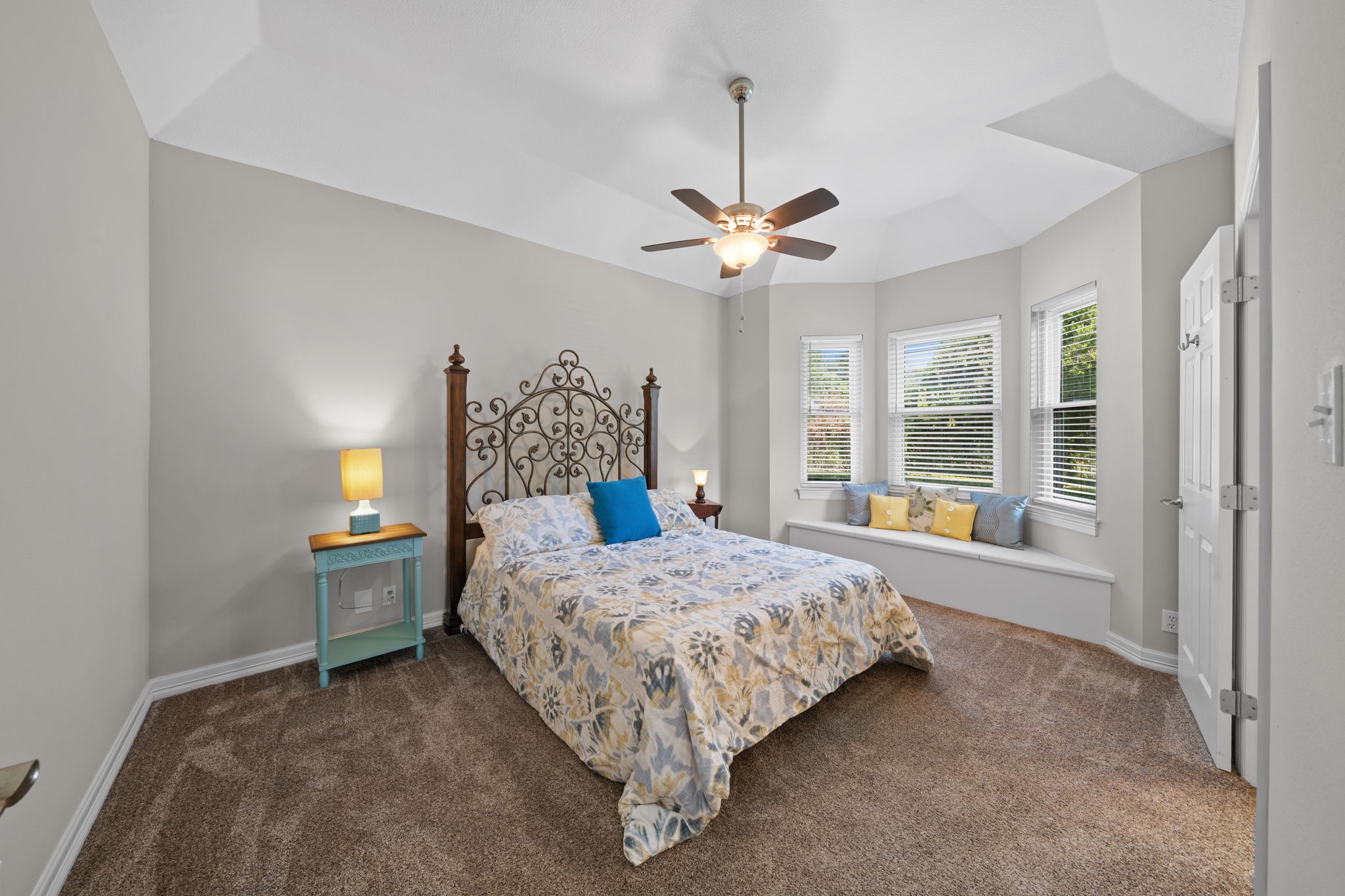 18355 Burkhardt Road Tomball, TX 77377 - Photo 28 of 50 a bed sitting in a bedroom next to a window