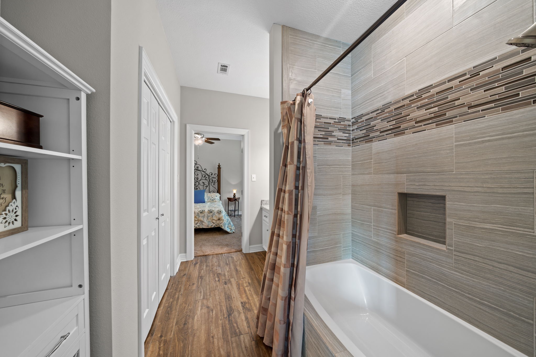 18355 Burkhardt Road Tomball, TX 77377 - Photo 31 of 50 a bathroom with a bathtub and a shower