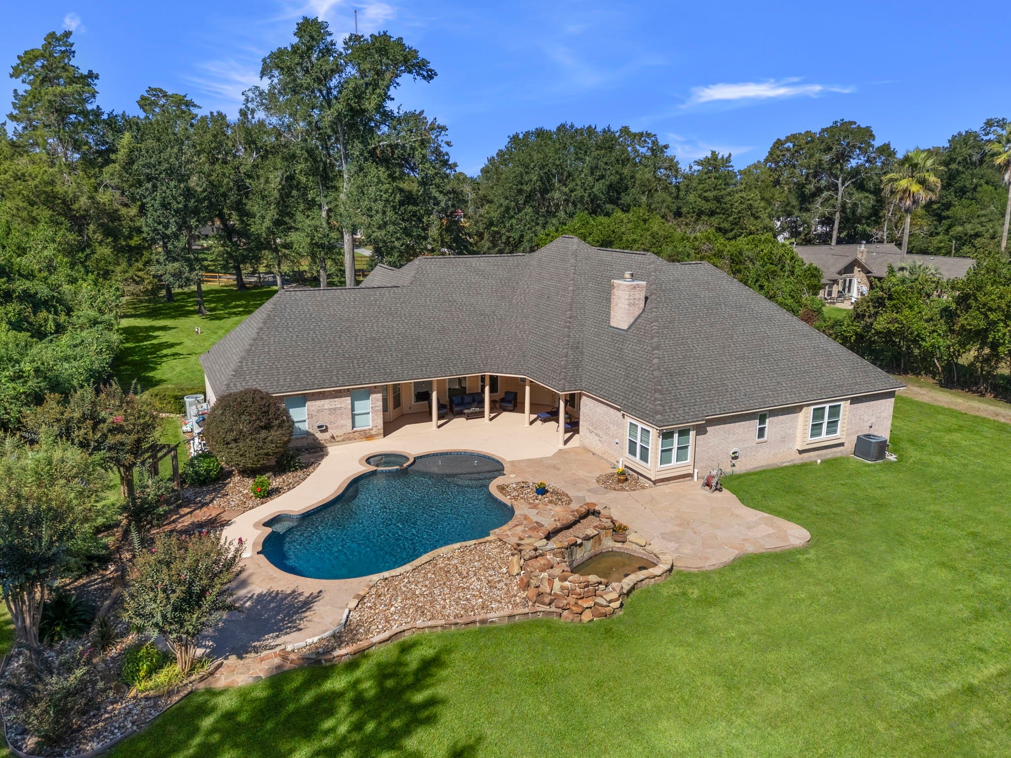 18355 Burkhardt Road Tomball, TX 77377 - Photo 38 of 50 an aerial view of a house with yard and mountain view in back