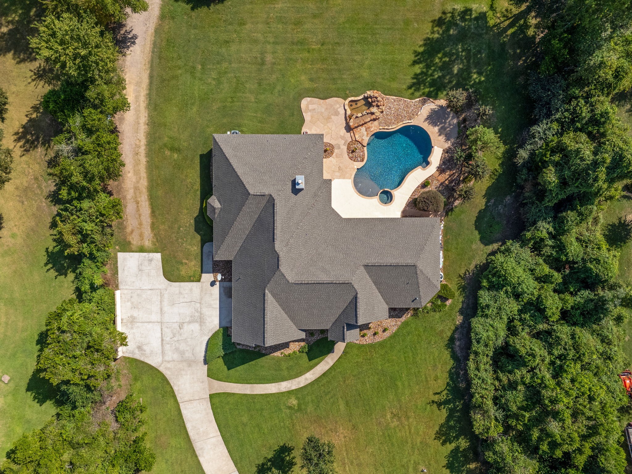 18355 Burkhardt Road Tomball, TX 77377 - Photo 41 of 50 an aerial view of a house with outdoor space and a lake view