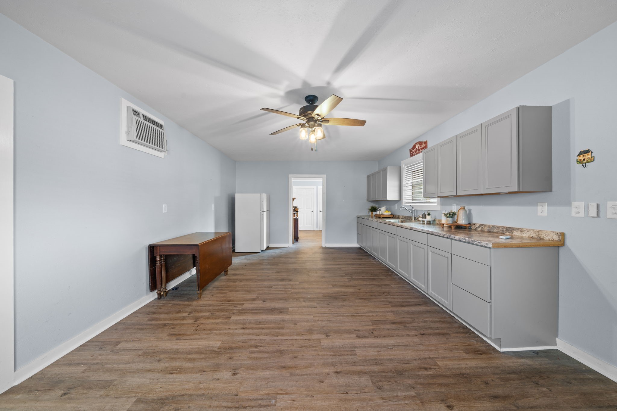 18355 Burkhardt Road Tomball, TX 77377 - Photo 46 of 50 a view of kitchen with sink microwave and cabinets