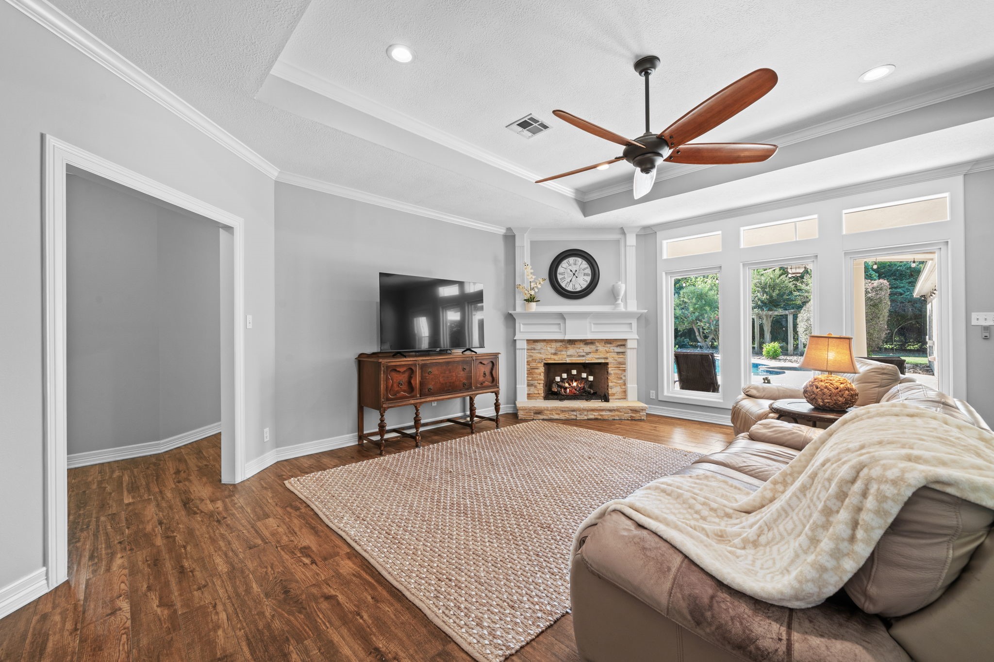 18355 Burkhardt Road Tomball, TX 77377 - Photo 10 of 50 a living room with furniture a fireplace and a window
