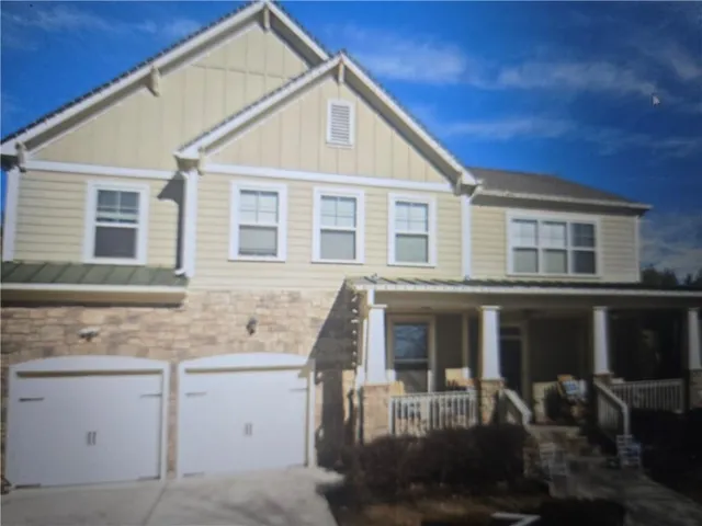 a front view of a house with balcony