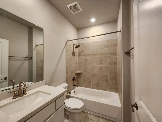 a bathroom with a sink a toilet and a bathtub