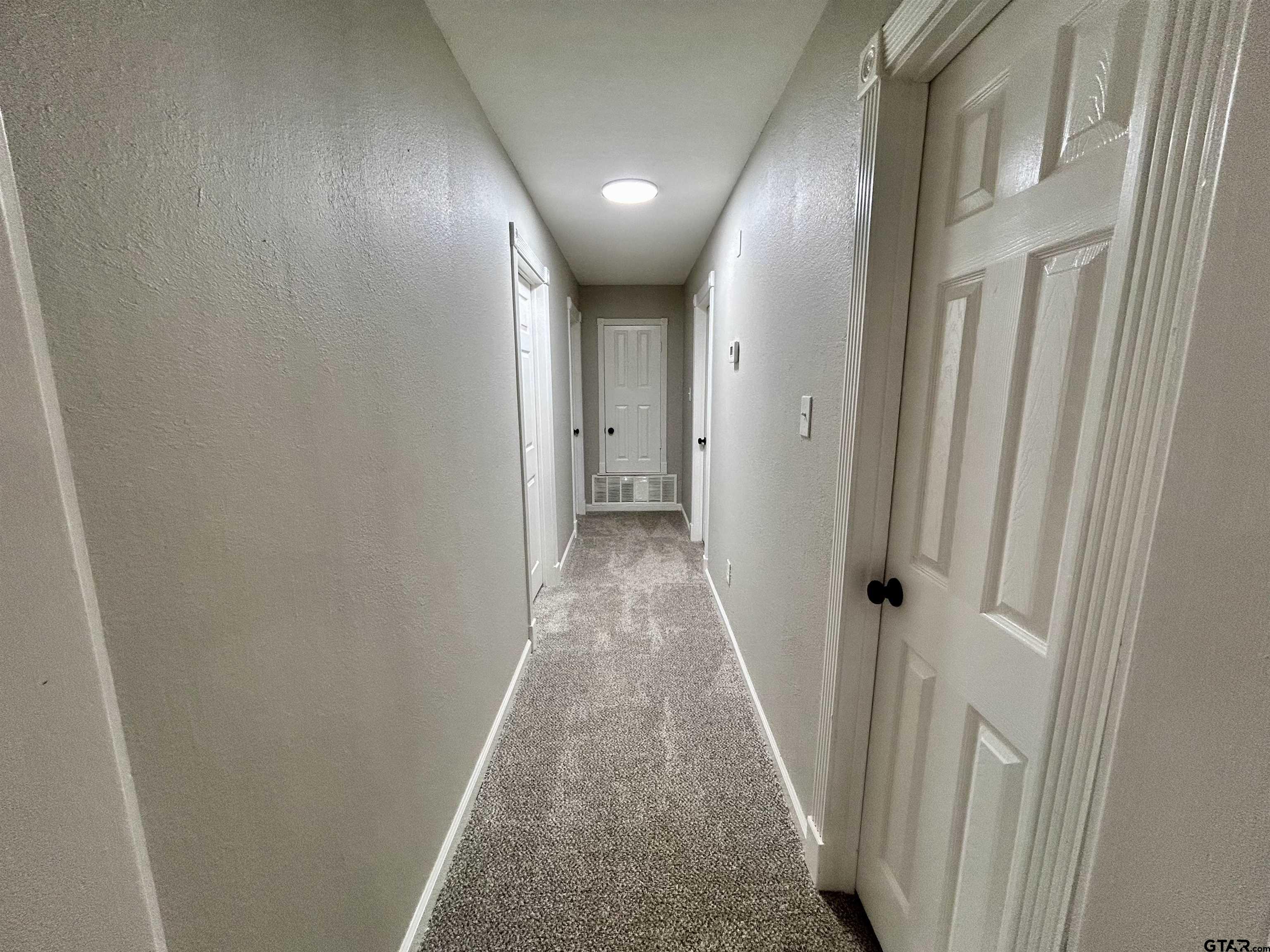 1106 Annette Drive Longview, TX 75604 - Photo 12 of 21 a view of a hallway with wooden floor