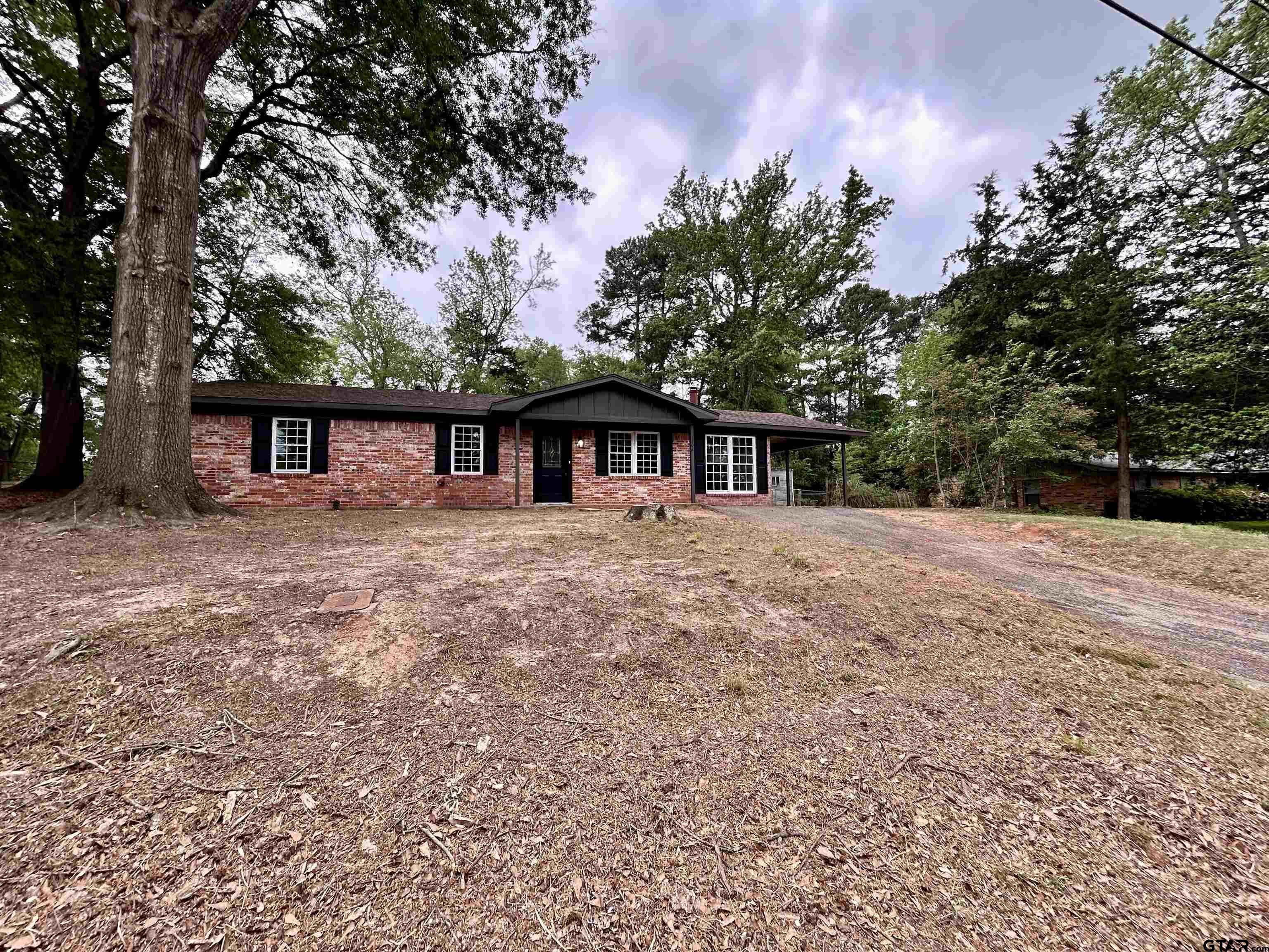 1106 Annette Drive Longview, TX 75604 - Photo 2 of 21 front view of a house with a tiny house