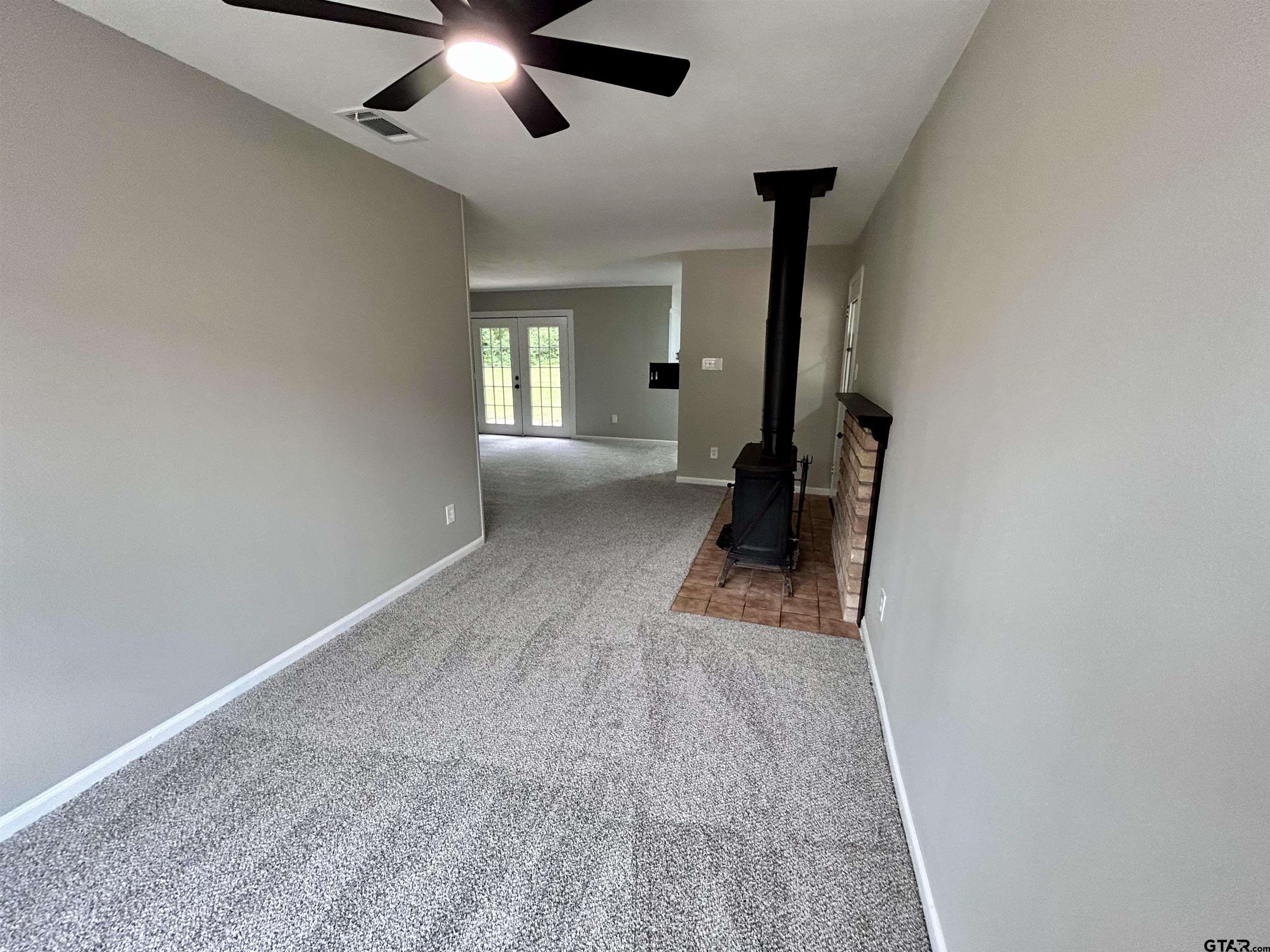 1106 Annette Drive Longview, TX 75604 - Photo 8 of 21 wooden floor in an empty room with a window