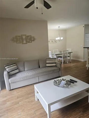 a living room with furniture and a table