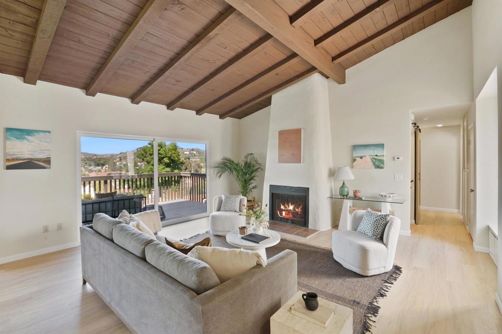 1126 Hermosillo Glen Escondido, CA 92026 - Photo 1 of 32 a living room with furniture and a fireplace