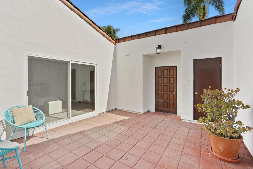 1126 Hermosillo Glen Escondido, CA 92026 - Photo 15 of 32 a view of a room with a potted plant and floor to ceiling window