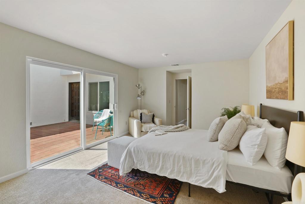 1126 Hermosillo Glen Escondido, CA 92026 - Photo 16 of 32 a bedroom with a bed and a window