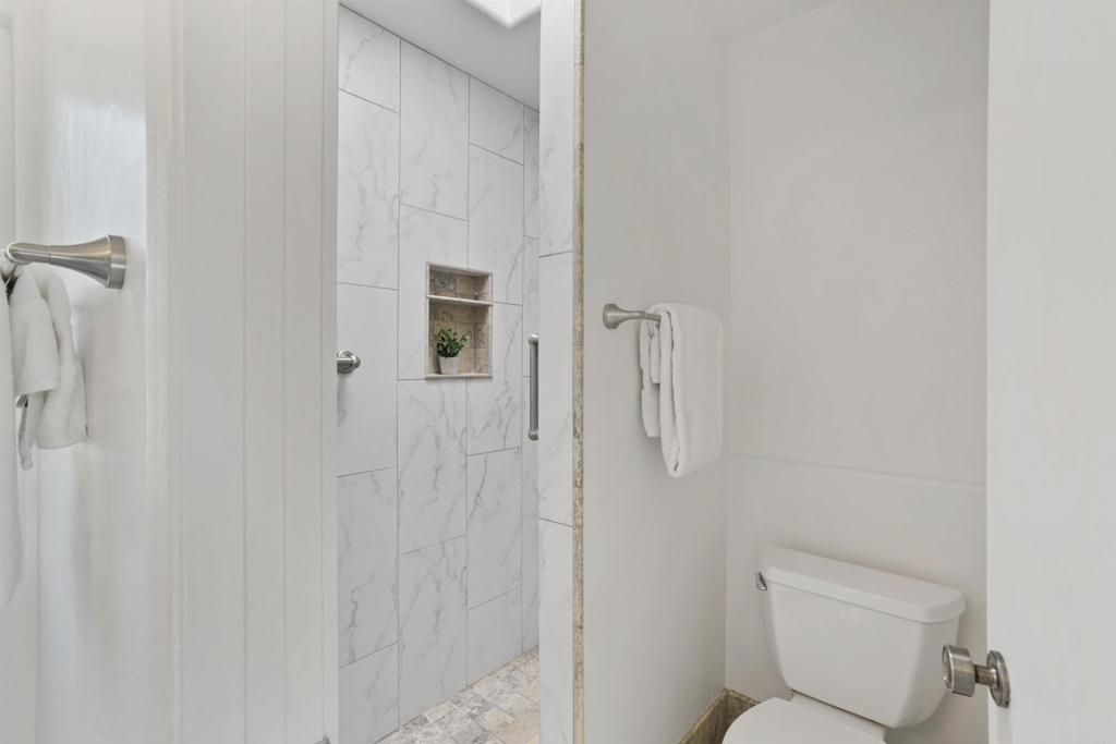 1126 Hermosillo Glen Escondido, CA 92026 - Photo 19 of 32 a bathroom with a toilet and a shower