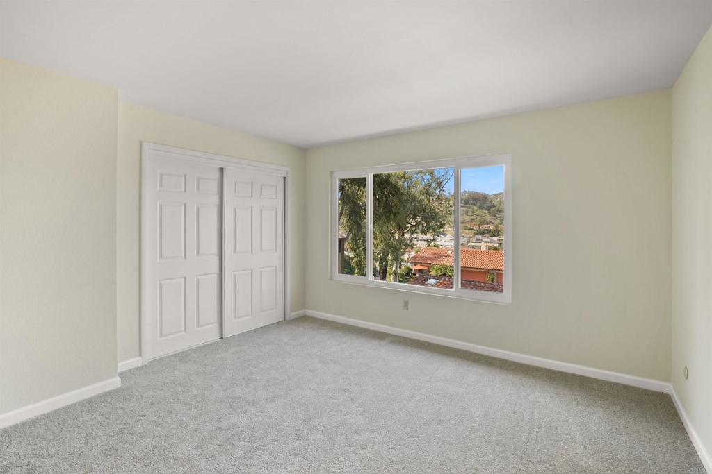 1126 Hermosillo Glen Escondido, CA 92026 - Photo 21 of 32 an empty room with windows