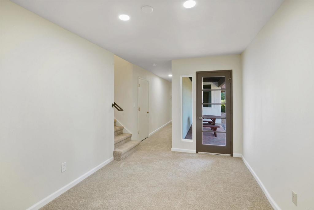 1126 Hermosillo Glen Escondido, CA 92026 - Photo 22 of 32 an empty room with a cabinet and a white rack