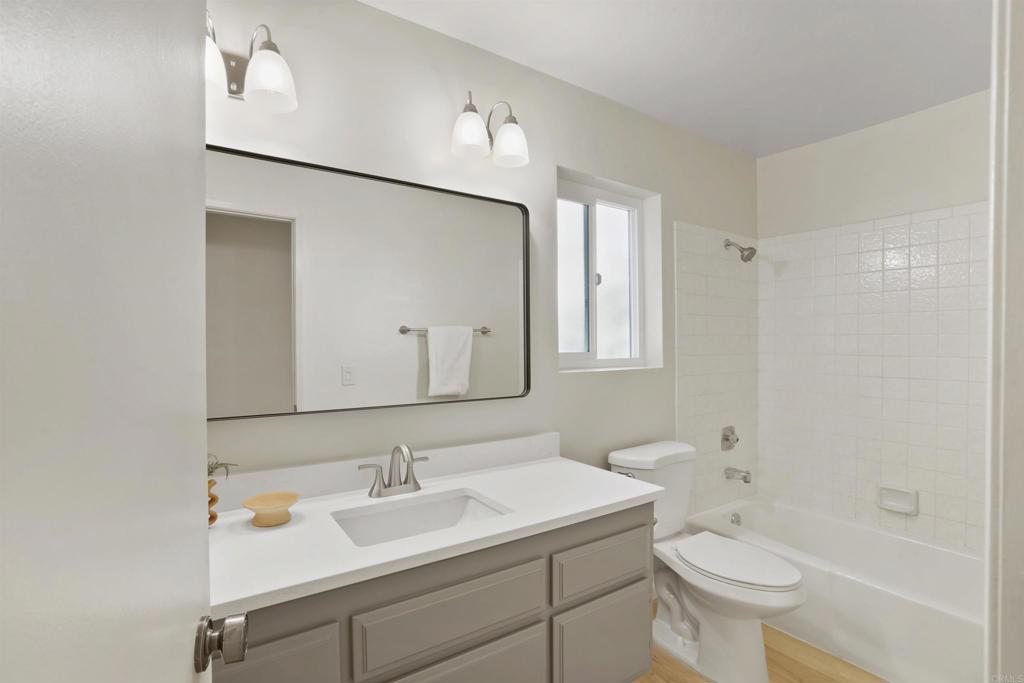 1126 Hermosillo Glen Escondido, CA 92026 - Photo 26 of 32 a bathroom with a sink toilet and shower