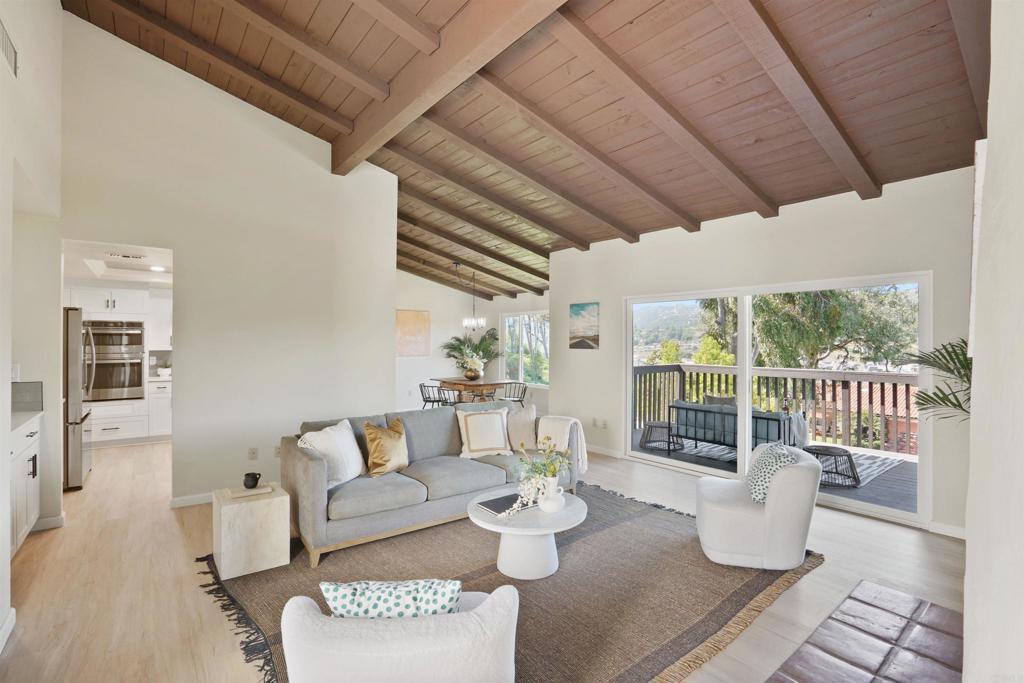 1126 Hermosillo Glen Escondido, CA 92026 - Photo 4 of 32 a living room with furniture and a wooden floor